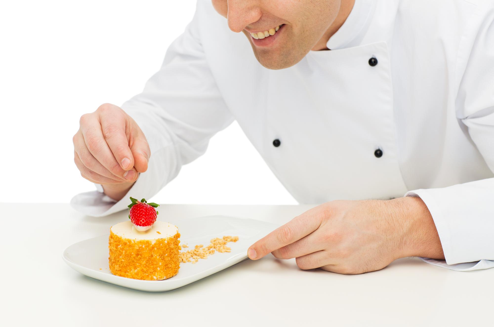 Pastry specialist arranging desserts